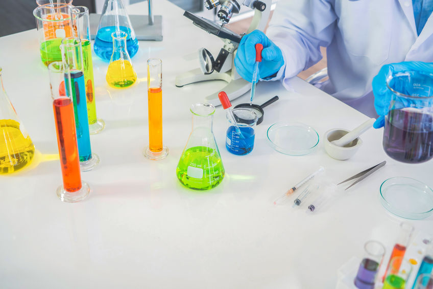 Scientist working on colorful test tube to analysis and develop vaccine of covid-19 virus in lab or laboratory in technology medical, chemistry, healthcare, research concept. Experimental science test